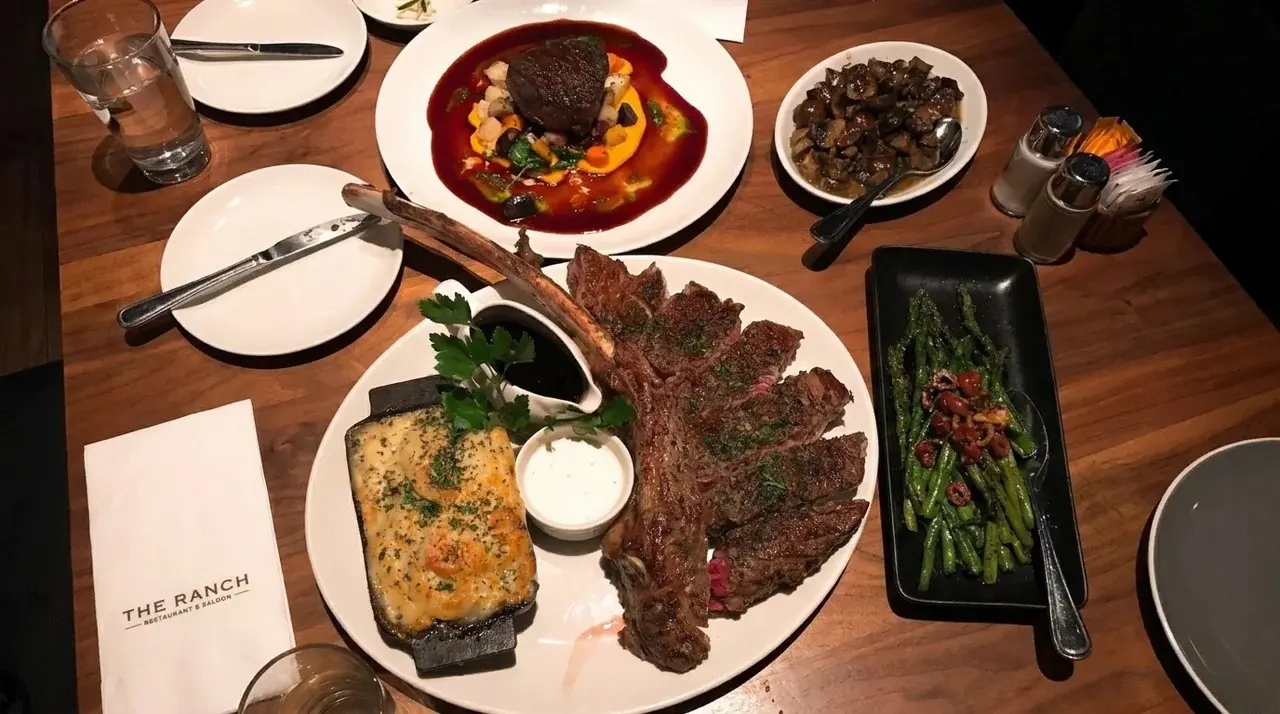 The Best Steakhouses in Orange County, California. Tomahawk steak at the Ranch Saloon