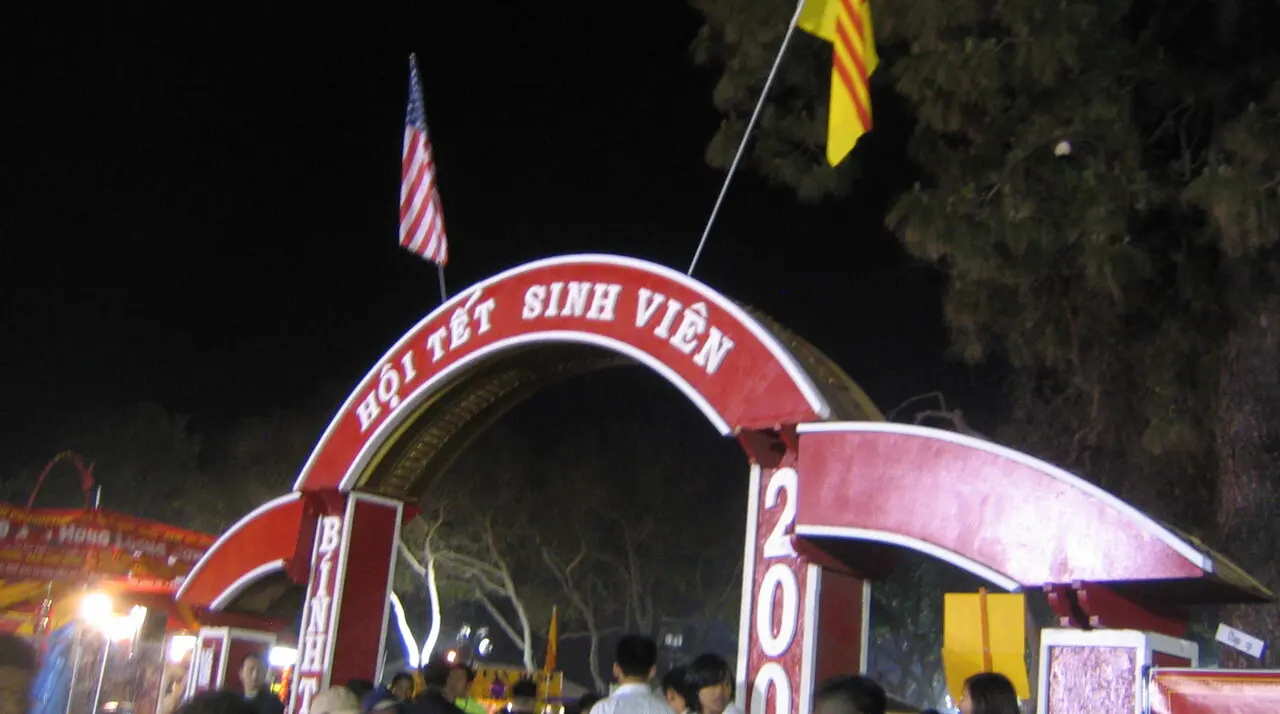 Illuminated entrance arch and crowd at the UVSA Tet Festival celebrating Vietnamese Lunar New Year