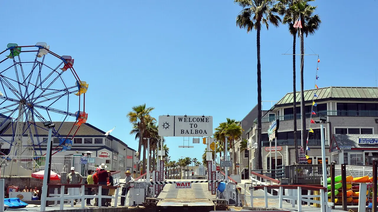Balboa Fun Zone Ferris wheel and Welcome to Balboa sign in Newport Beach