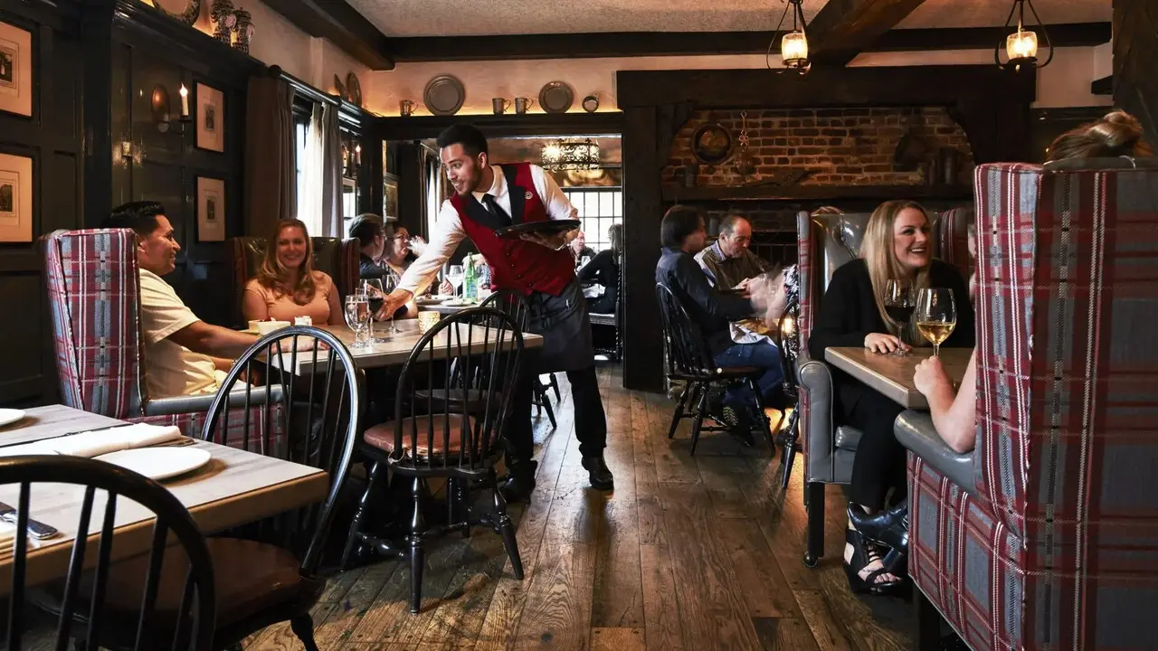 Warm wood dining room at Five Crowns steakhouse in Corona del Mar for anniversary dinner